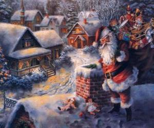 yapboz bir baca yanındaki bir evin çatısına Noel Baba
